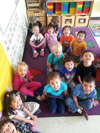 Preschool children learning through story time.