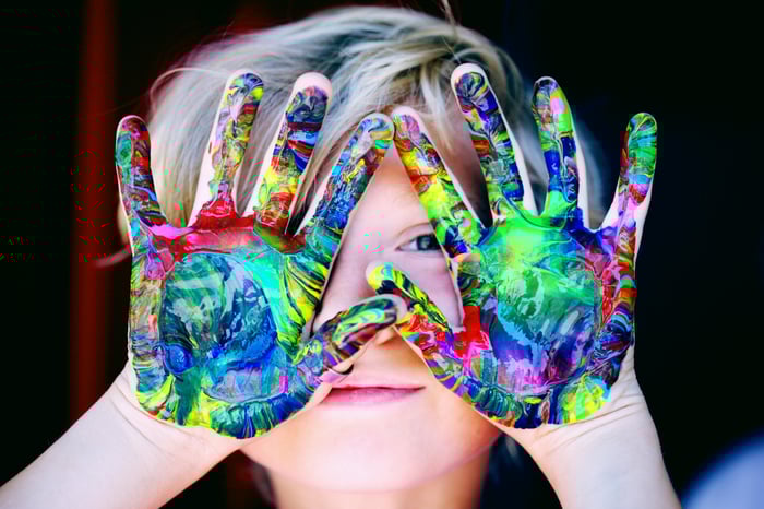 Kids with paint on his hands